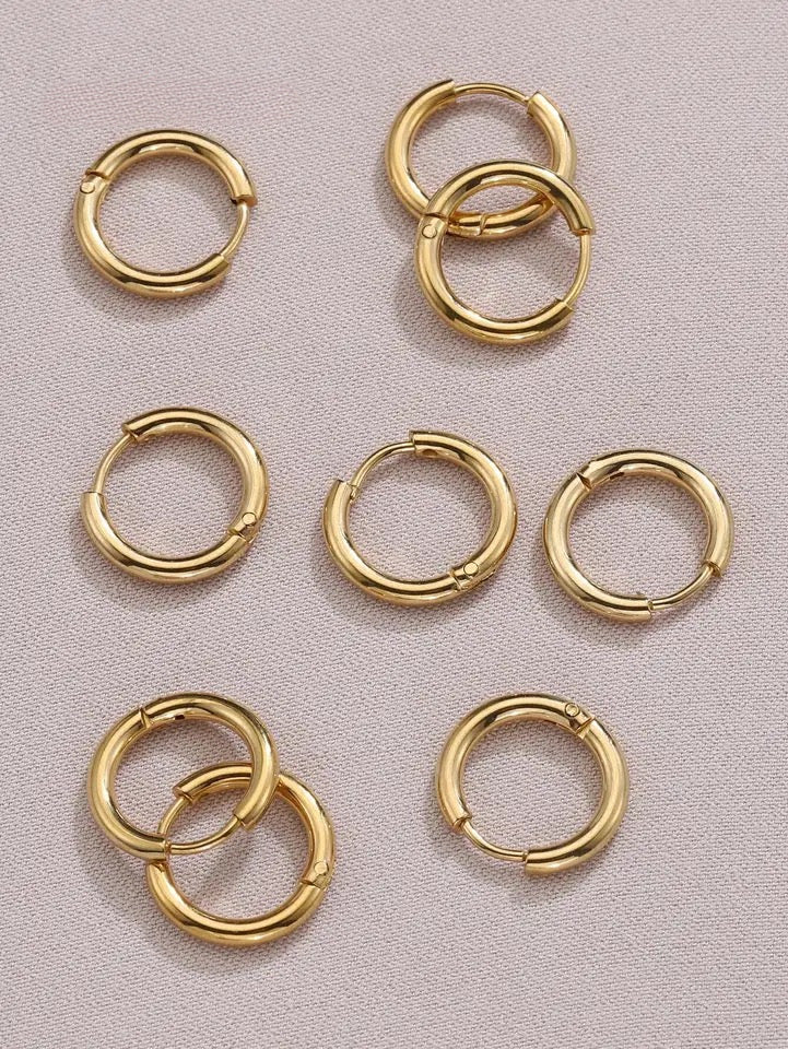 "Simple gold hoops - timeless elegance for any occasion."