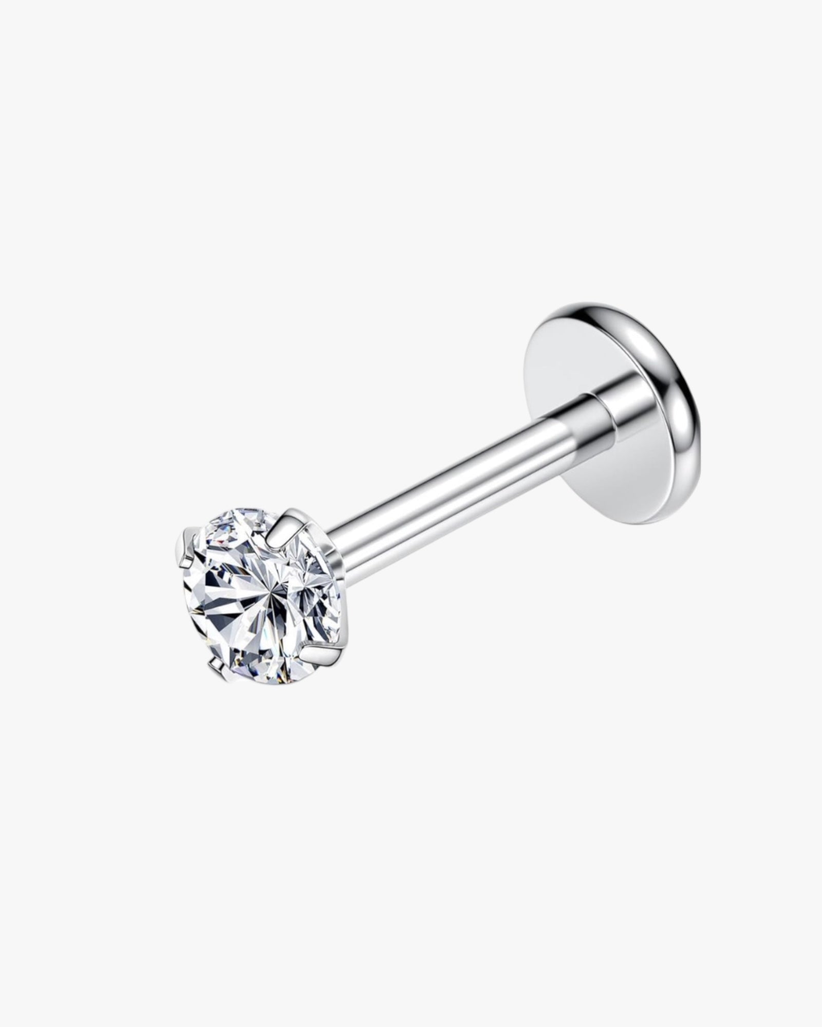 A single titanium stud earring with a clear, diamond-shaped centerpiece.