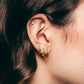 Gold plated pavé crystal hoop earrings in ear – Bari