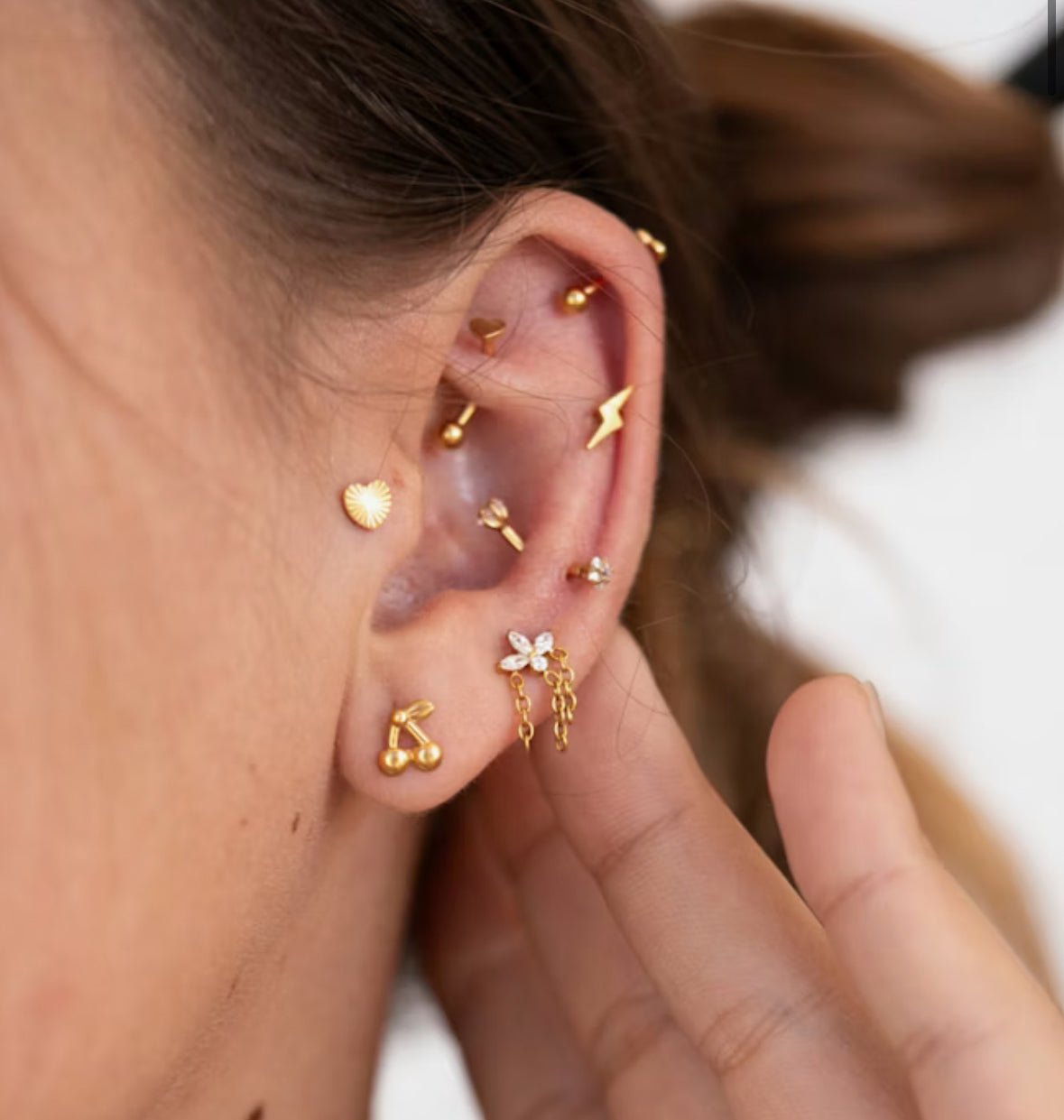 Gold plated titanium cherry stud piercing in ear  – Cherry Bomb