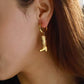 Gold plated cowboy boot charm hoop earrings in ear – Cowgirl Hoops