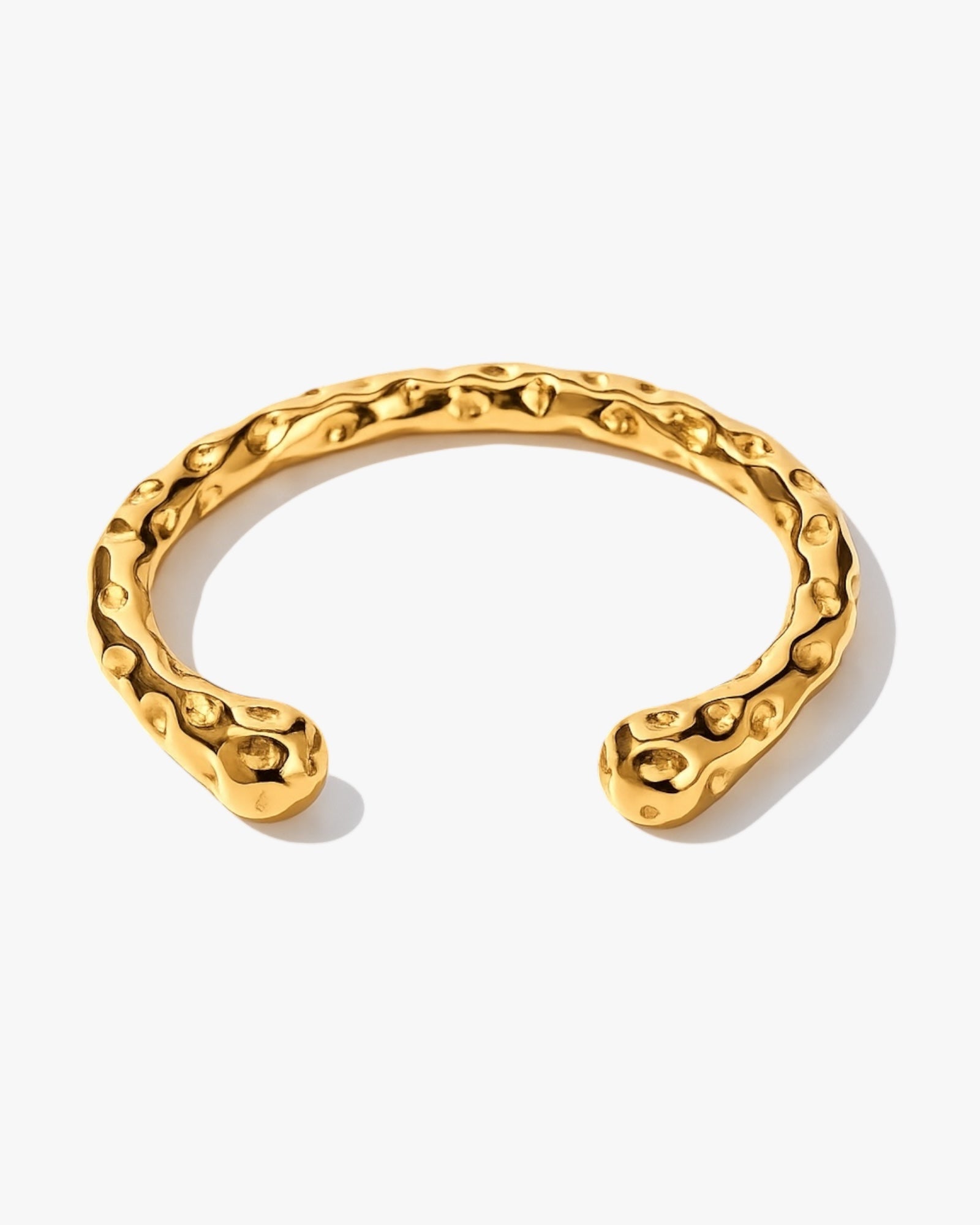 Aurea hammered gold bangle bracelet in gold with 18K gold plated stainless steel statement design
