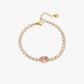 Serelina gold tennis bracelet with pink zircon center stone and 18K gold plated stainless steel