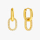 Gold drop earrings with oval zircon pendant