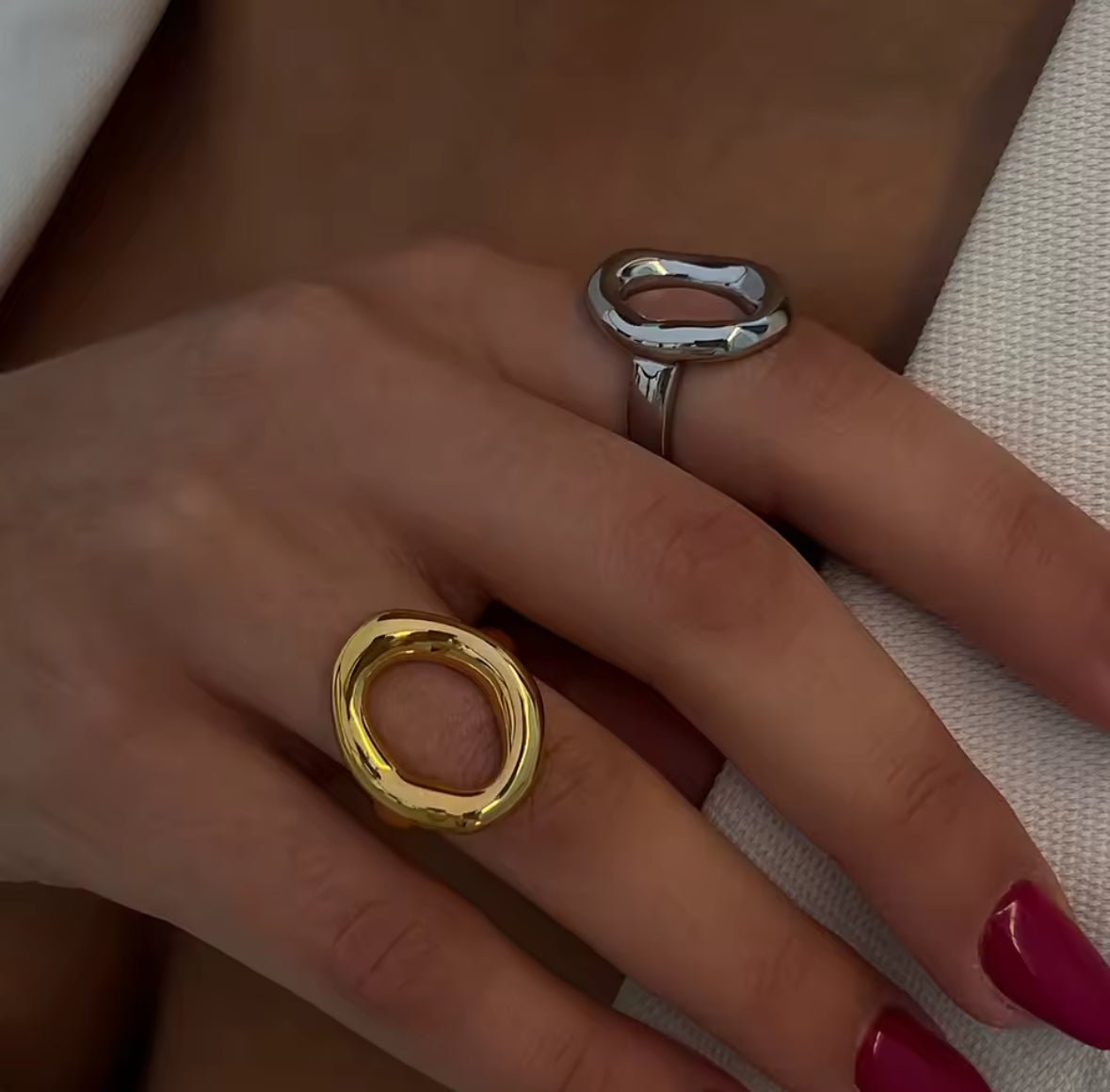 Open oval sculptural gold ring with PVD 18K gold plated finish, modern minimalist jewelry on finger