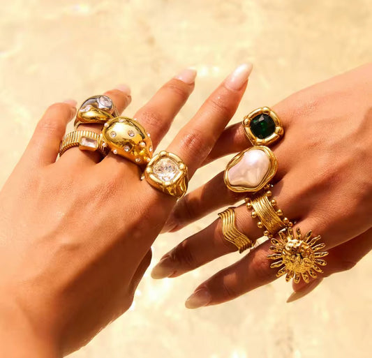 Gold plated crystal statement ring on finger