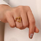 Minimalist open heart gold ring with PVD 18K gold plated finish, elegant everyday jewelry on a finger