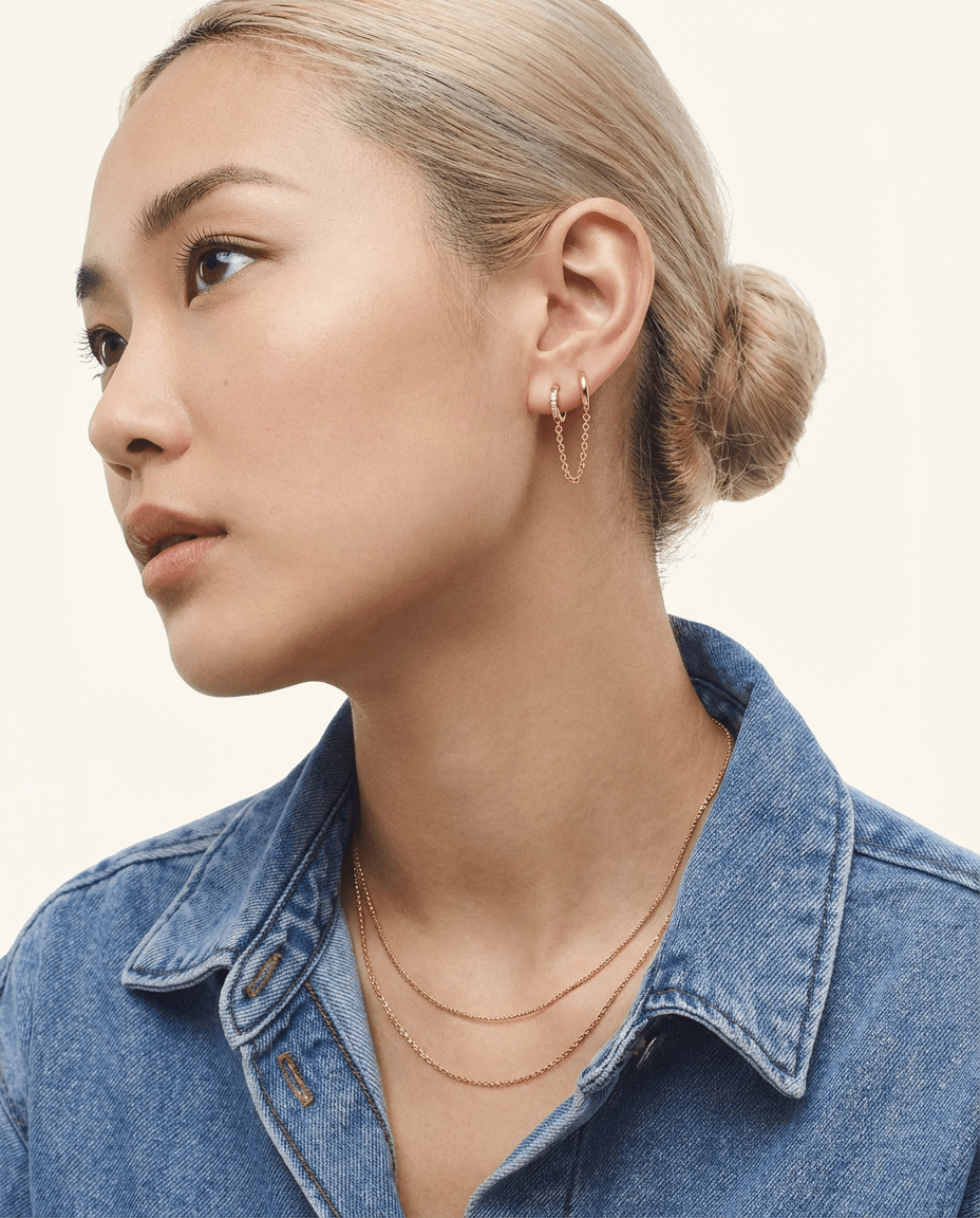 Gold plated double hoop chain earring with pavé crystals on a model – Sini